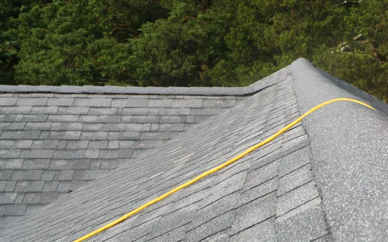 Example photo: Asphalt ridge cap shingles running along a hip and ridge